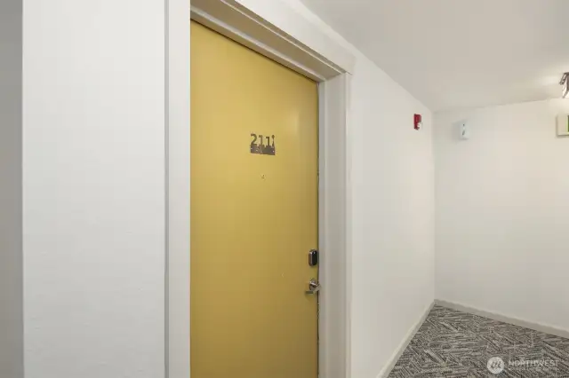 Entrance to unit on second floor of building.