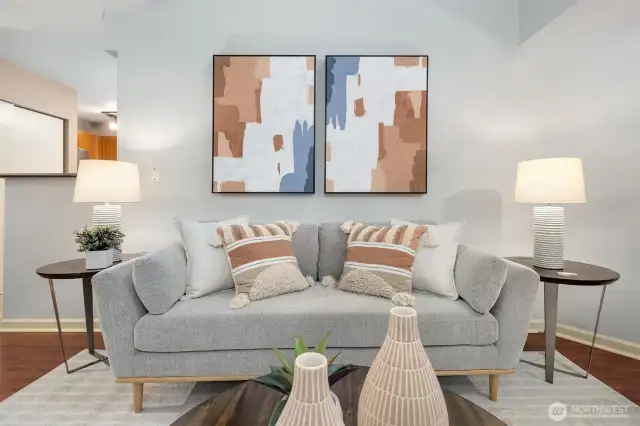Spacious living room offering natural light streaming through from windows above.