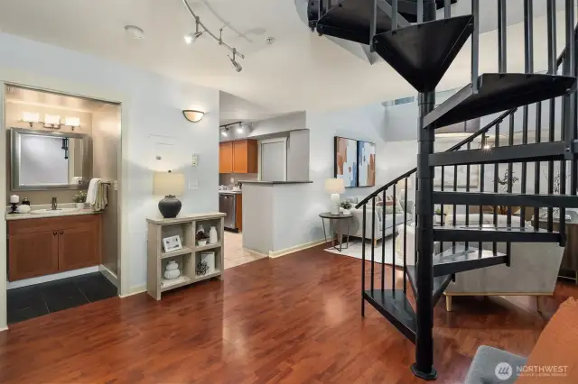 Entrance to condo leading to a light filled living space.