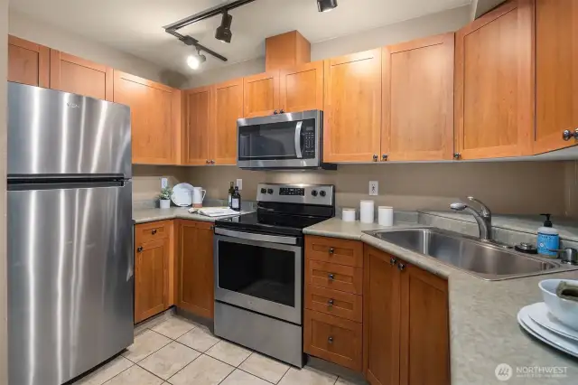 Sleek kitchen with stainless steel appliances.