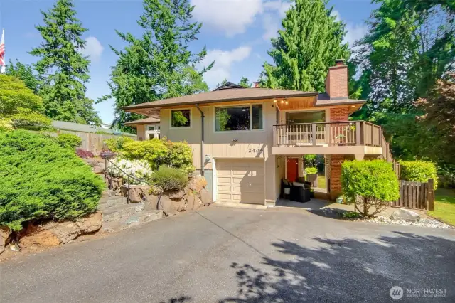 Large driveway with Xtra large single car garage & carport which is used as a covered lower patio