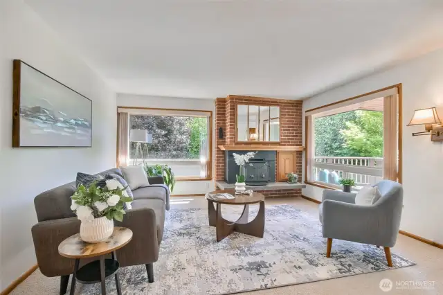 Upper Living Room w/ newer windows, fireplace, hardwoods under carpeting.