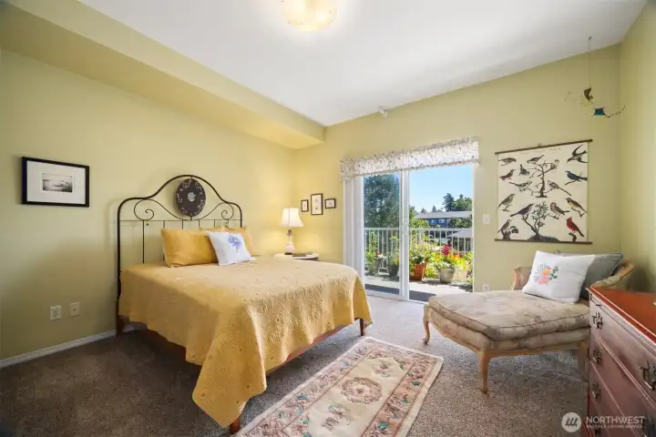 Spacious bedroom with plenty of room for a reading chair and dressers.