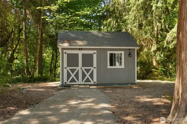Additional shed storage for lawn mower and gardening or yard tools.