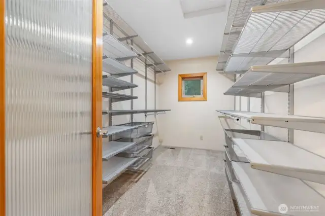 Custom organizers in this large primary closet.