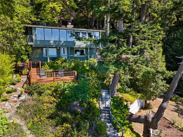 There are stairs to access the house, from below or above. But the railings are solid and the surfaces sure.
