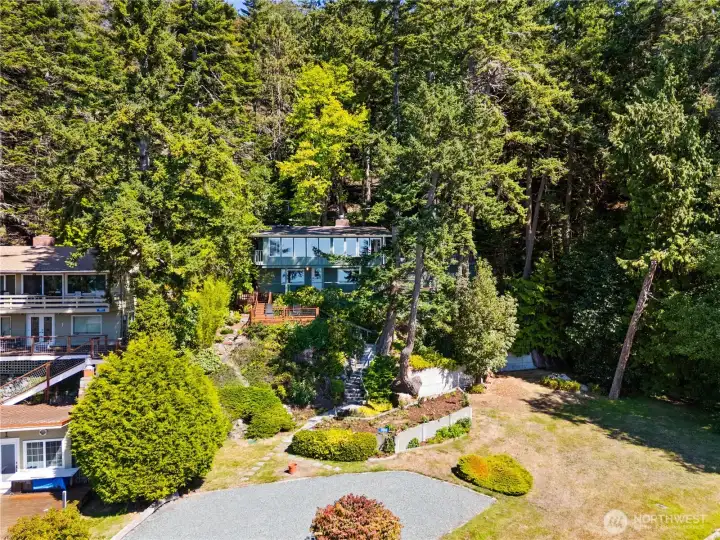 This property includes two parcels. The vacant lot to the south insures privacy, and might accommodate an ADU, creative landscaping, or something else beside the lake (check with local planning department).
