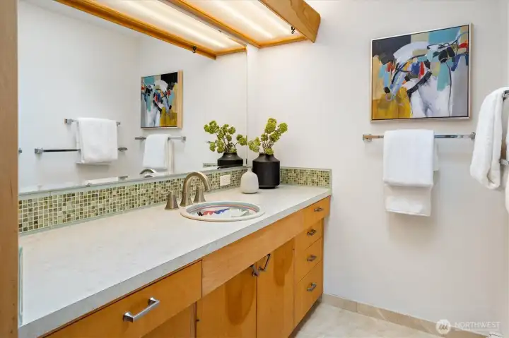 Large main floor full bathroom with double sinks.