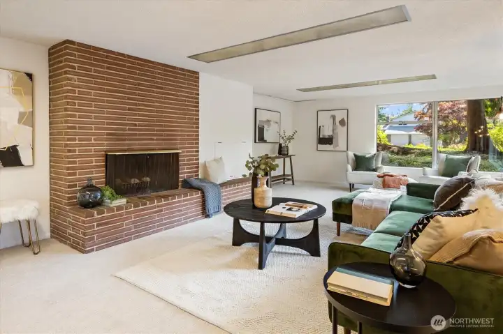 Down the stairs a lovely, large family room with wood burnign fireplace and wall of windows.