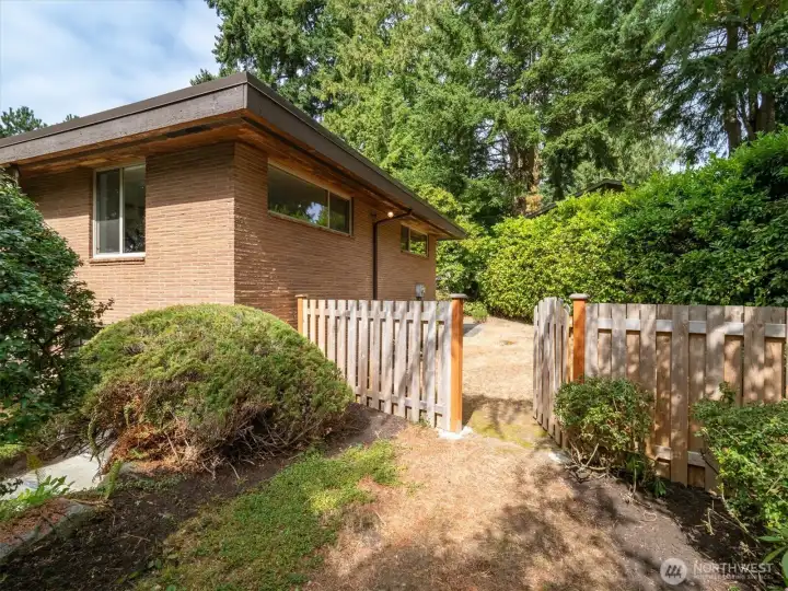 Next to the garage is easy access to the side yard.