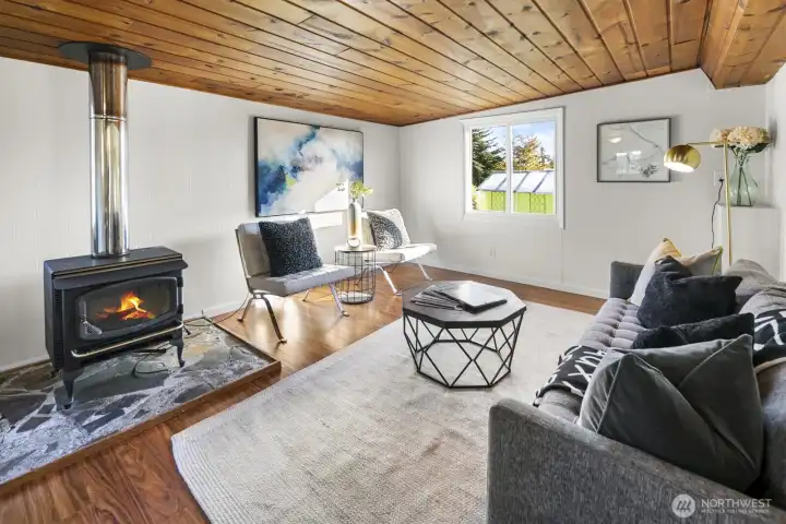 Cozy up in the spacious family room—anchored by a classic wood-burning stove.