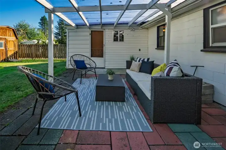Step out to a covered patio overlooking your fully fenced backyard.