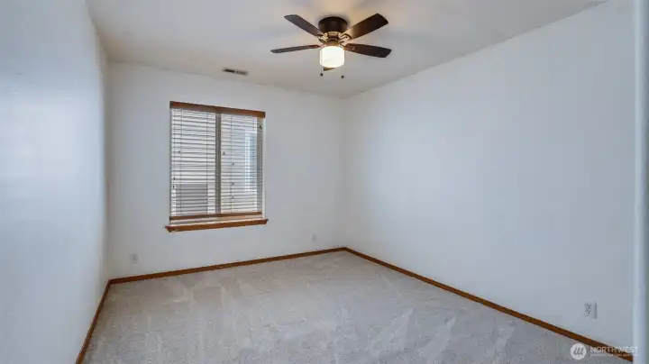 Lounge in the comfort of this fully carpeted upstairs bedroom
