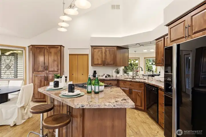 Dine-in kitchen with both island seating and a breakfast nook.