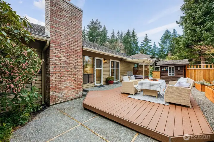 Backyard complete with a deck, a covered area with hot tub, gardening shed and raised flower beds. Sprinkler system and drip lines are in place for ease in watering.