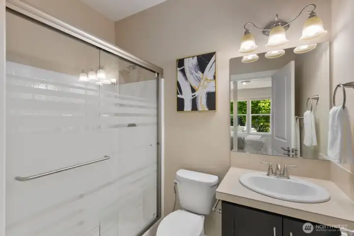 Guest space/ office suite Bathroom with beautiful privacy glass door for the shower.