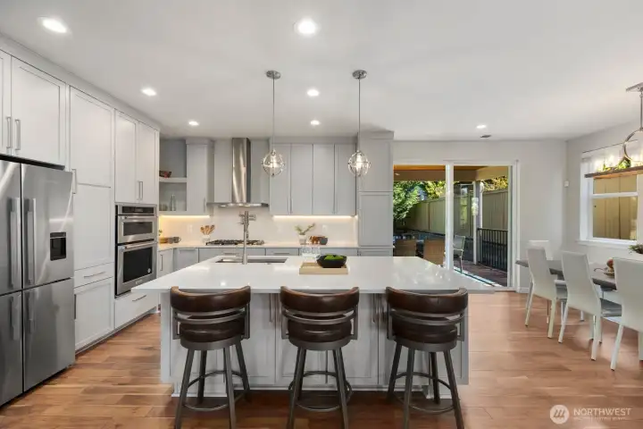 Open concept remodeled modern kitchen with Hunt wood cabinets