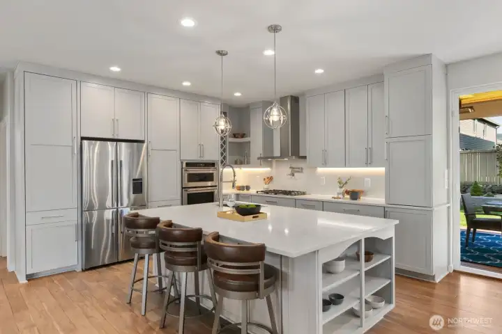 Thoughtfully designed kitchen island featuring abundant storage on all sides, blending everyday functionality with clean modern design