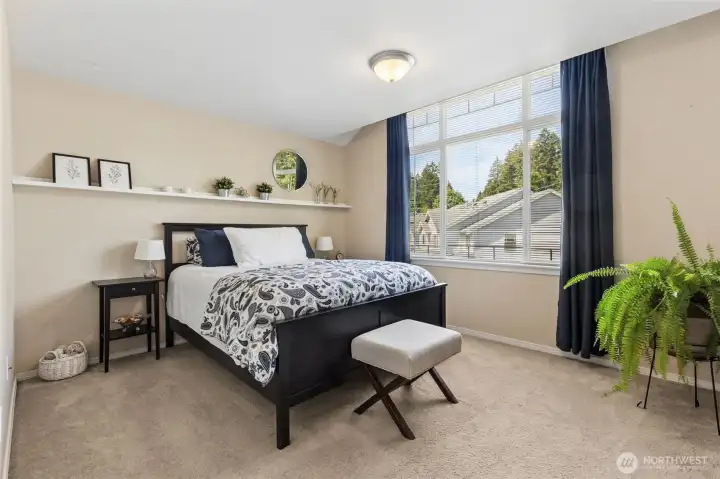 Great sized guest bedroom 1 w/huge window and really large walk in closet!