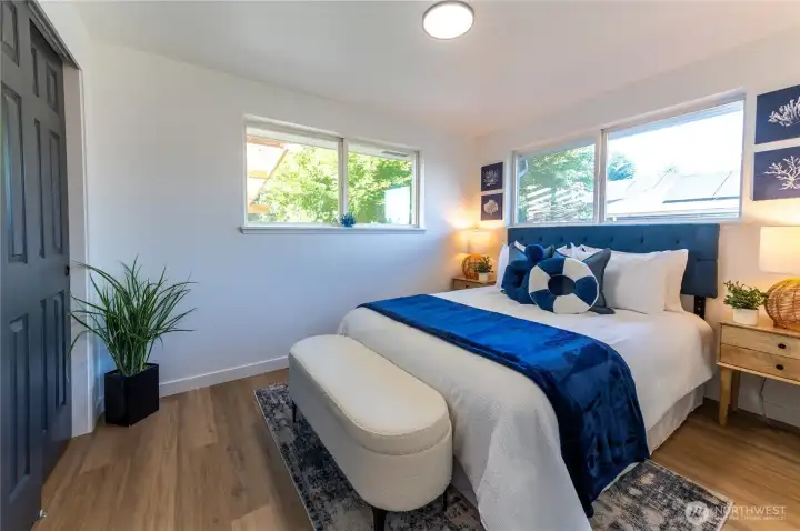Second bedroom with soft natural light and a warm, welcoming feel.