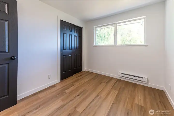 Third bedroom with double closet and updated flooring throughout.