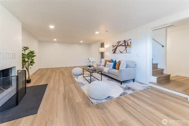 The daylight basement rec room is a whole second living space, with a fireplace, shiplap accent wall, and more natural light than you would expect downstairs.