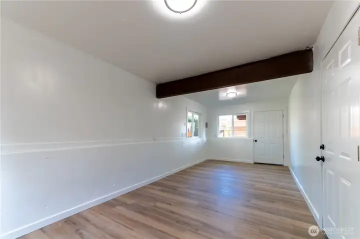 The garage bonus room is finished and powered with windows and wood beam detail. Studio, workshop, gym, creative space, you decide.