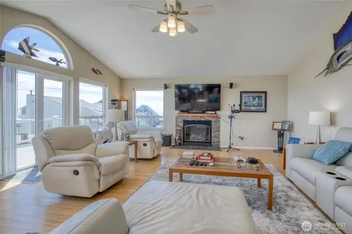 The Open Concept Living area will be THE Place to Host Guest with the vaulted ceilings, Stone Fireplace and Bamboo flooring, but again it is the views from the windows and Hurricane French doorsthat will be the thrill of the day!