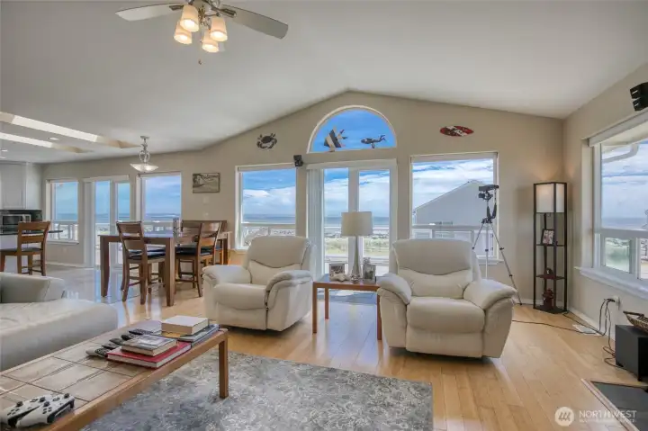 The Open Concept Living room opens up to a 180 degree Jetty and Ocean views through the wall of windows!