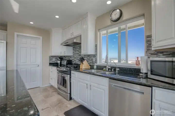 All the stainless steel appliances from the propane stove, dishwasher, refrigerator and wine cooler gives the kitchen that epic clean feeling!