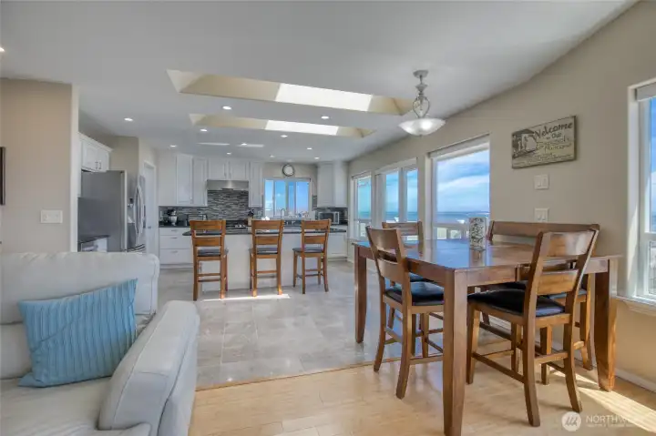 Or try to remain seated for dinner while the sunset skies fill the Entertainment area with Bright Reds, Oranges and Blues through the enlarged windows and Hurricane Doorways in the Evening!