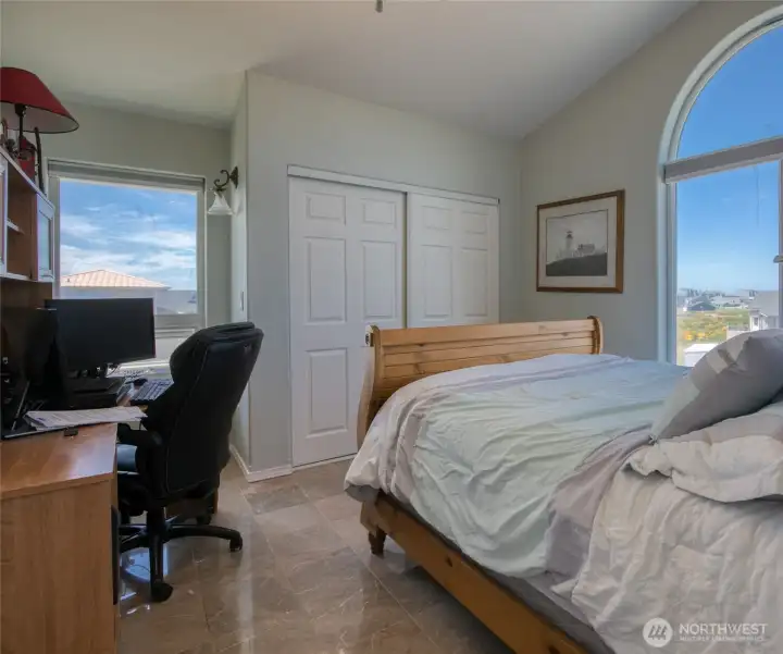 Hidden behind the Open Concept Living area is a Guest Room/Den with Marble flooring and breath taking views of the Ocean!