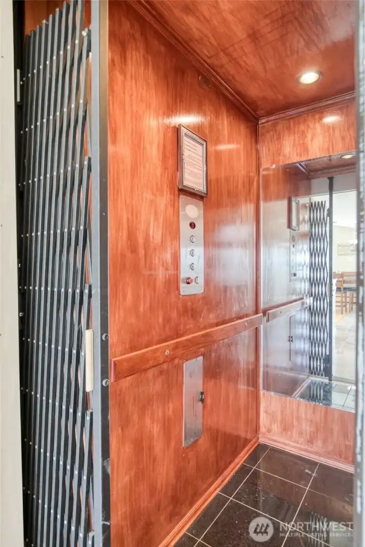 Ride in style to the Second Level in this Hemlock, Granite and Mirrored Elevator or.....