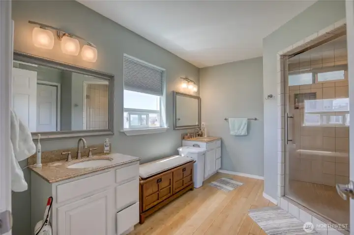 The attached en-suite continues with Bamboo flooring Granite double sinks or take a long shower with your favorite person under the huge dual shower!