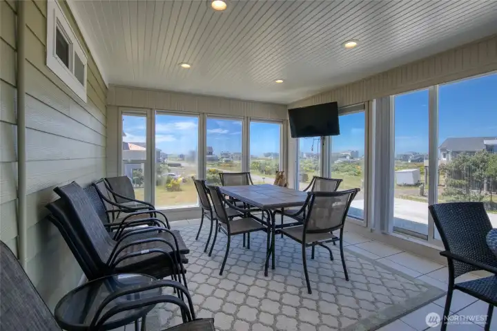 Entertain Guests in the Second Story Terra Catta Tiled Solarium with terratorial views of Jetty Homes!