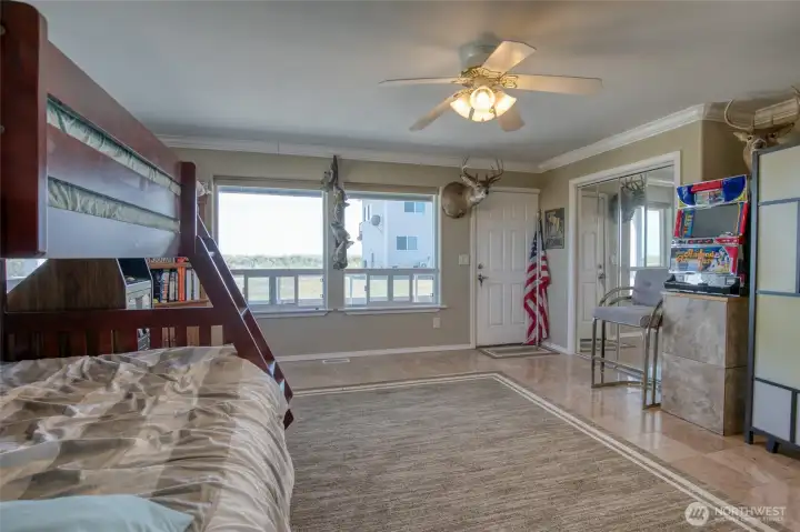 There is a Guest Room on the First Level with Granite Flooring and Mirrored Closet!  Each Level has it's own Private Trex Deck!