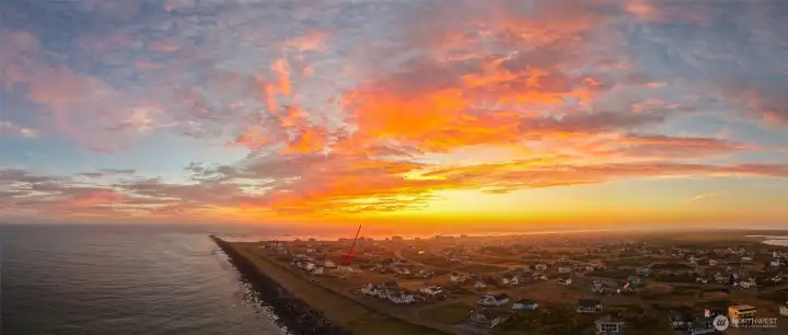 Panoramic View of a Sunset on the Jetty showing the adjoining homes and identifying the home with an arrow!