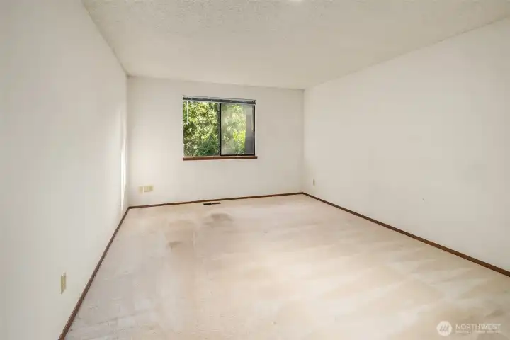 Another view of the upstairs primary bedroom. Another view of the upstairs primary bedroom.