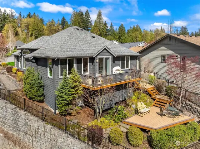 Located on a large corner lot, perched high above the street enjoy abundant privacy.