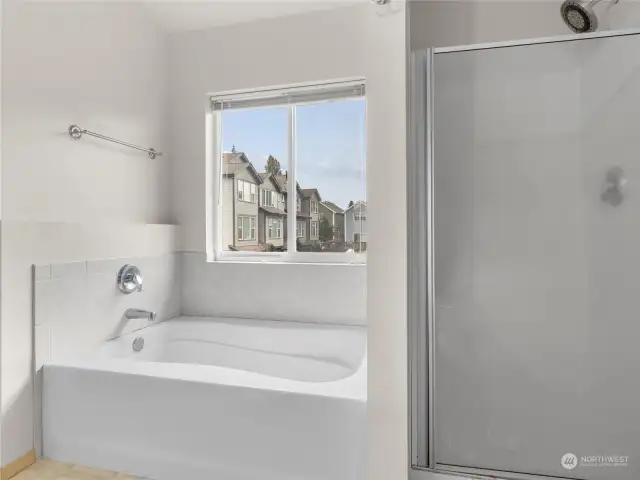 Primary bathroom with separate tub and shower