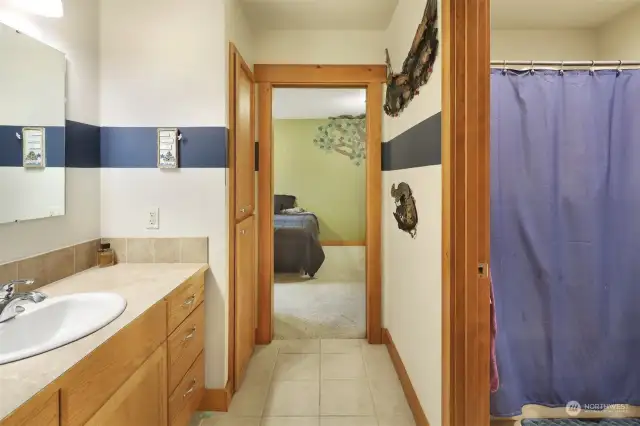 Jack & Jill bath with private water closet/tub shower combination.  Perfect arrangement for sharing a bathroom!