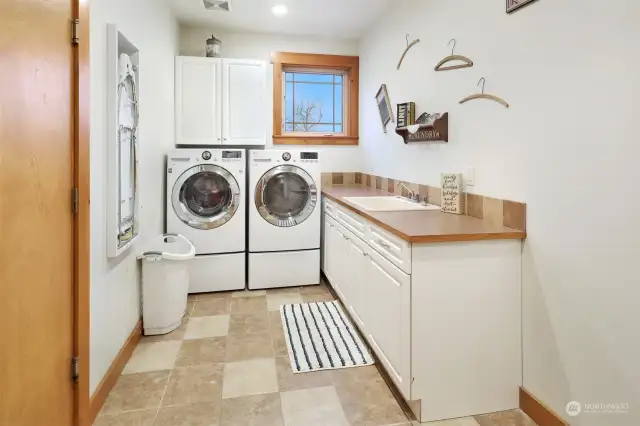 The huge laundry room is the pass through between the home and the garage.