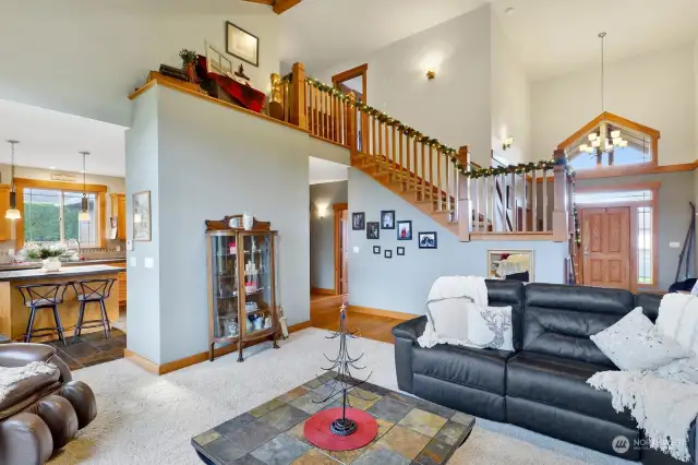 The open staircase makes a statement & assures connection to the upper level.