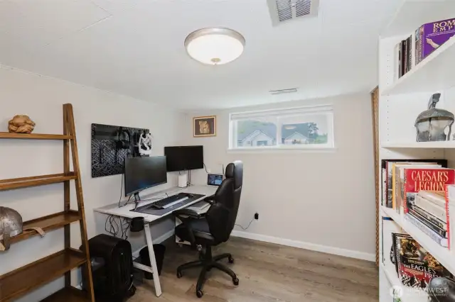 Downstairs room being used as an office.