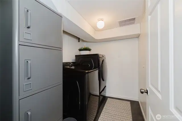 Laundry room with storage. Washer and dryer are included.