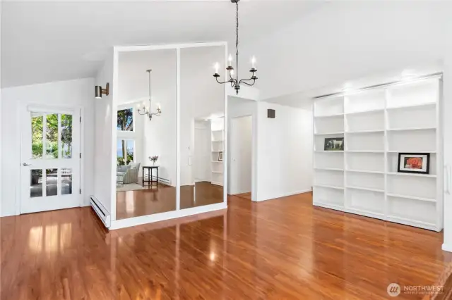 The dining table can be situated under the chandelier.