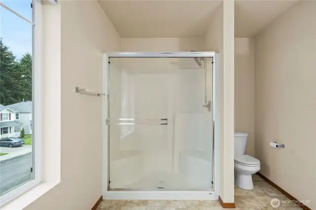 Walking-in shower in the primary bathroom