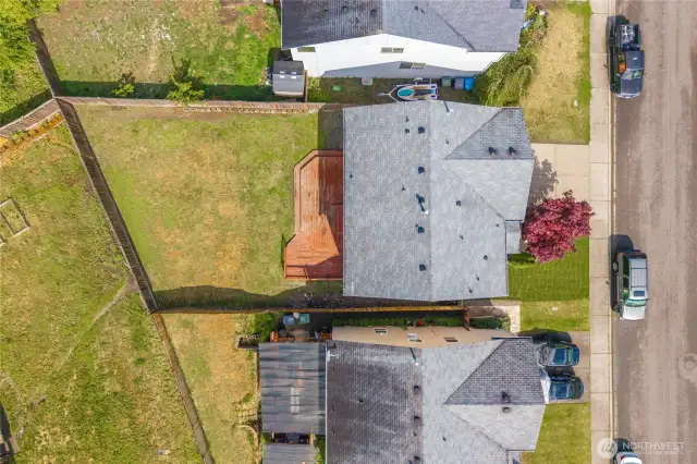 The bird’s-eye view showcases the subject property’s spacious backyard.