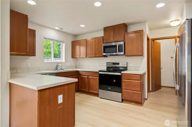 Spacious kitchen offering abundant cabinet storage and generous countertop space—perfect for cooking and entertaining.