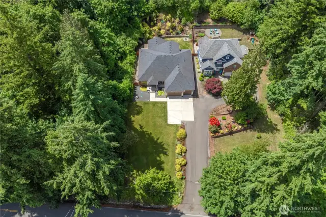 Enjoy the privacy of this long driveway and being tucked and surrounded by greenery